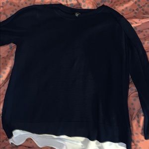 A long sleeve navy blue sweater